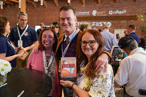 Author and USMC veteran Brian O’Hare with fans of his book.