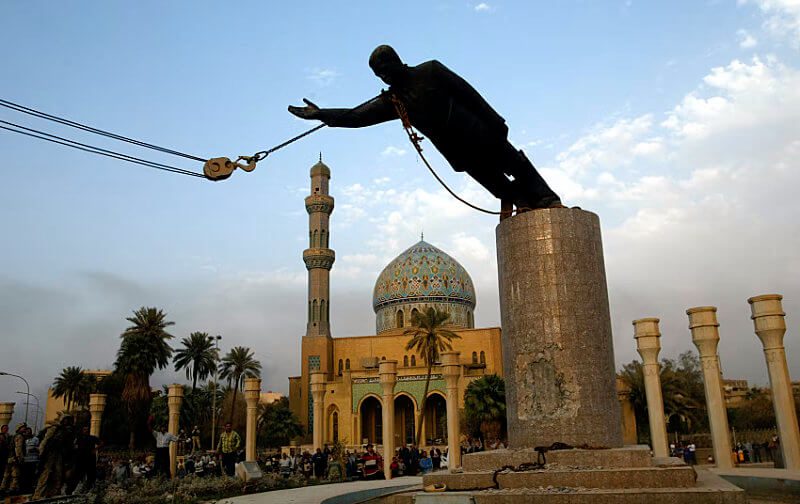 Statue of Saddam Hussein being pulled down in Bahgdad, a result of the US invasion after September 11 (9/11) terrorism